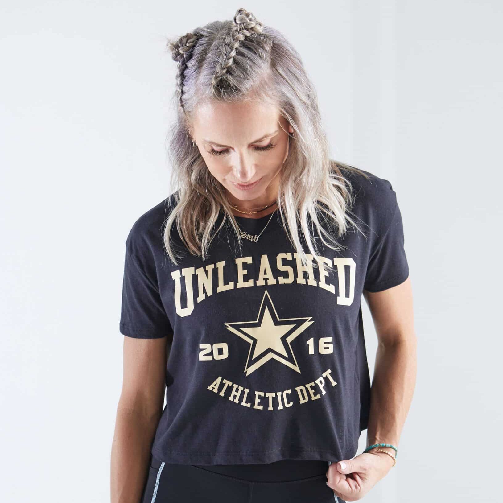 An Unleashed Health and Fitness branded cropped tee.